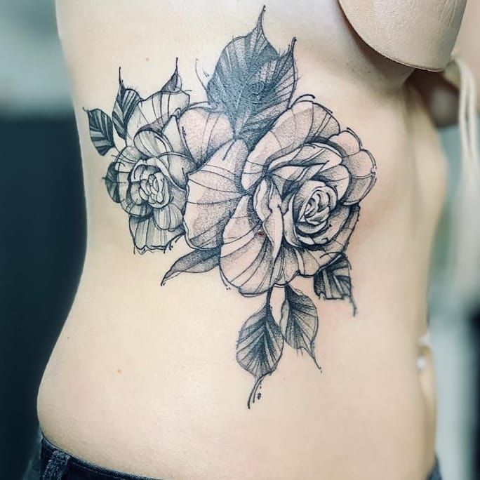 a woman's stomach with a rose narben tattoo on her stomach, bonn, germany