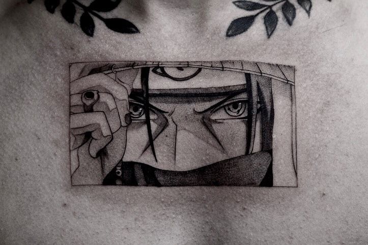 a man's chest with a black and white drawing of a man's face