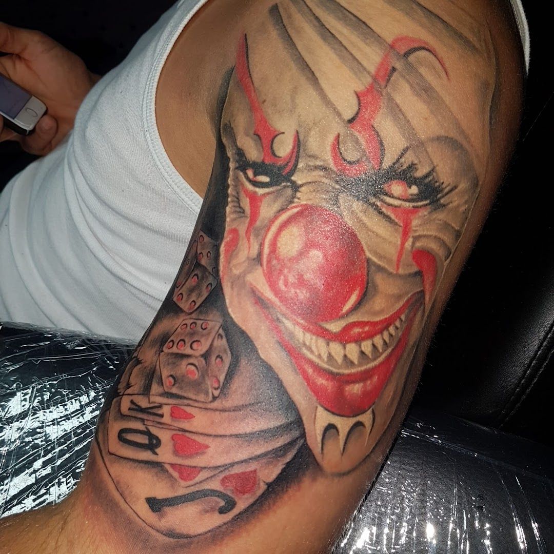 a narben tattoo of a clown with a red nose and a black and white face, kreisfreie stadt oldenburg, germany