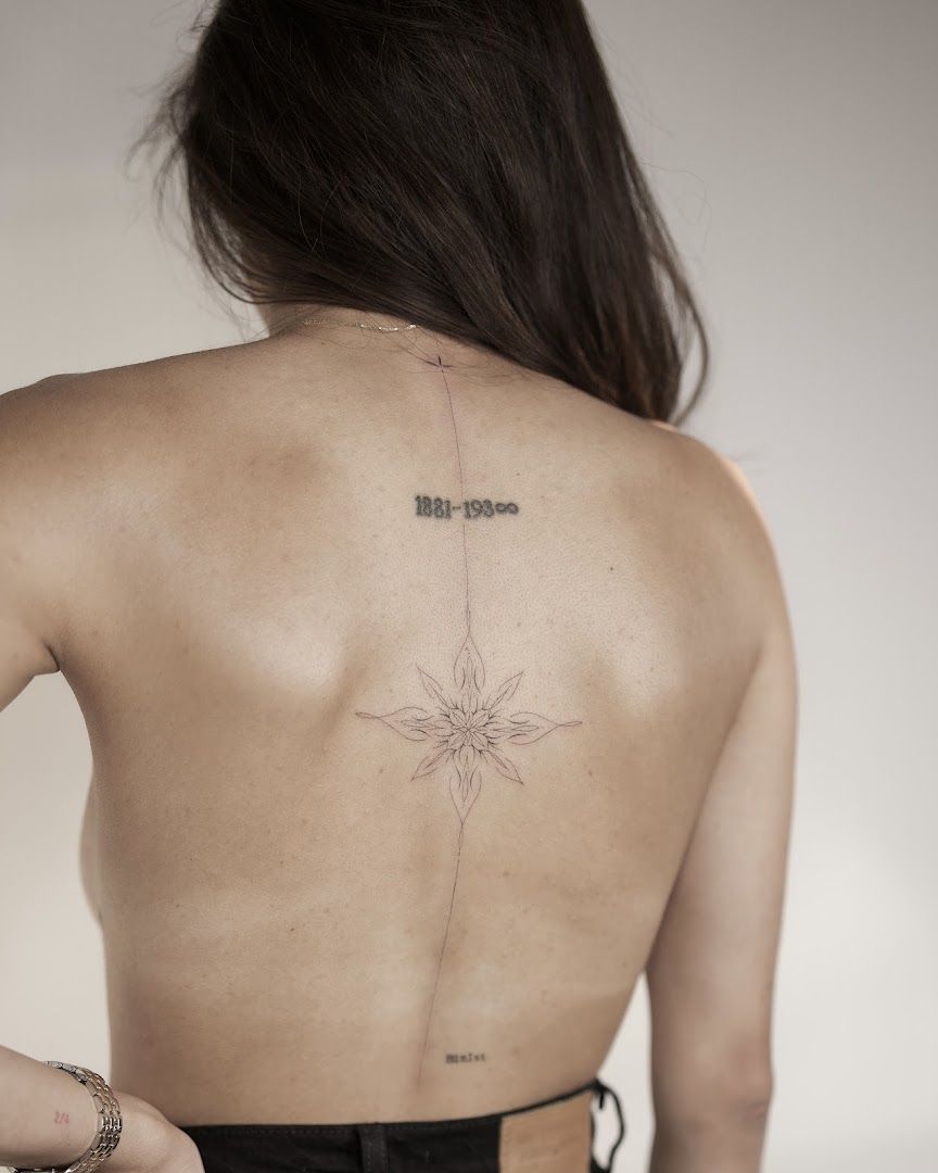 a woman with a narben tattoo on her back, berlin, germany