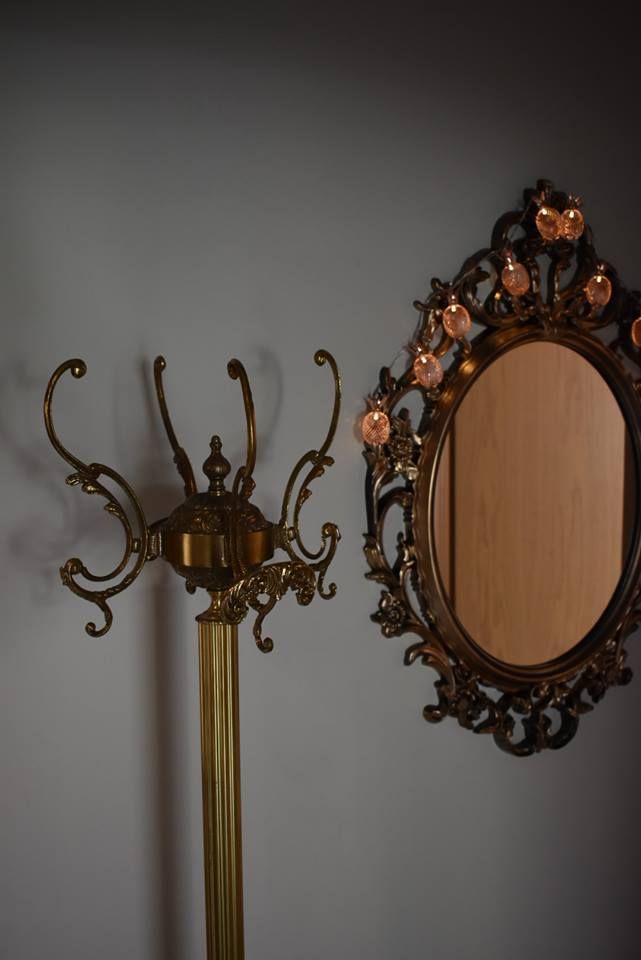 a mirror and a lamp on a wall