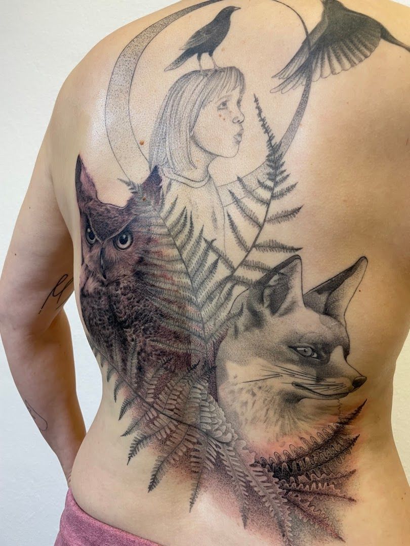 a woman with a bird and a cat on her back