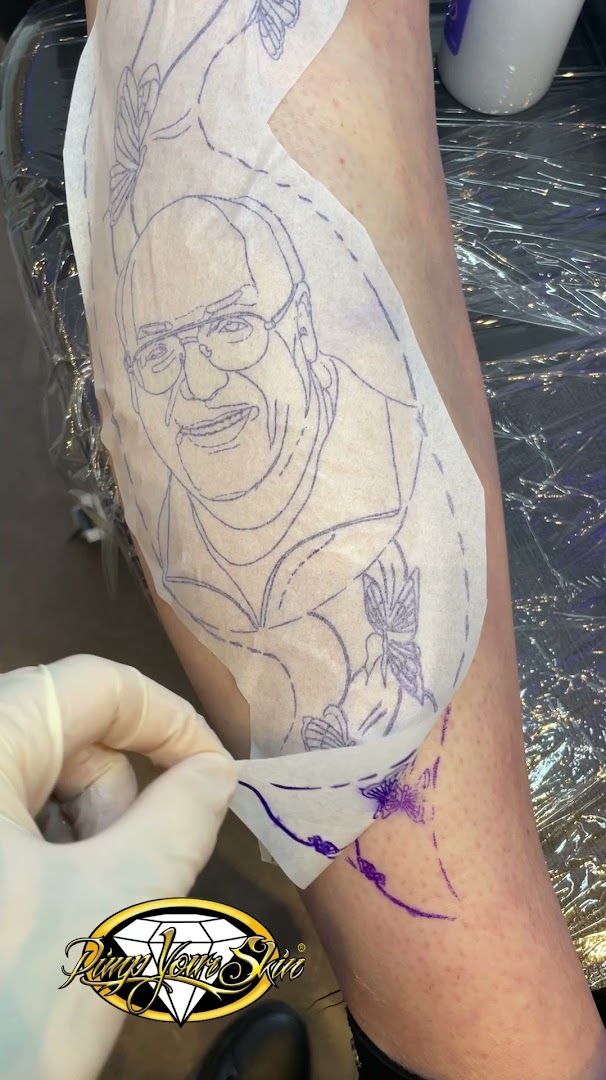 a cover-up tattoo artist is working on a tattoo, augsburg, germany