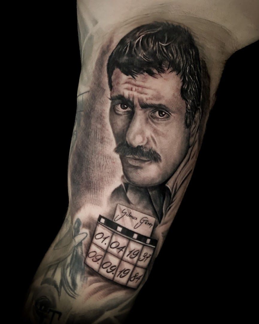 a man with a camera cover-up tattoo on his arm, rhein-neckar-kreis, germany