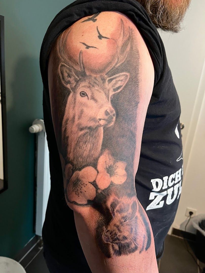 a man with a deer japanische tattoos in leipzig on his arm, alzey-worms, germany
