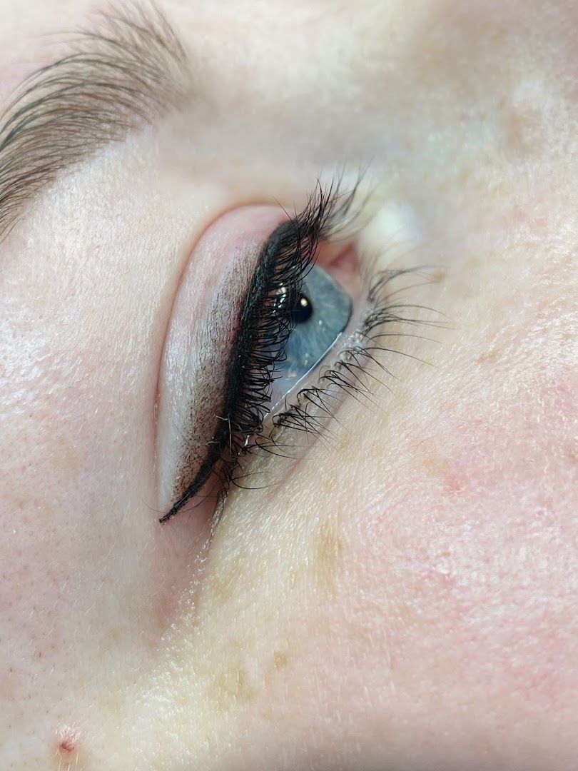 a woman's eye with long eyelashes