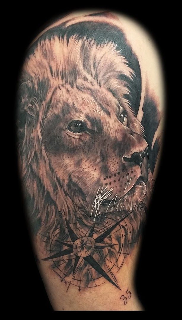 a lion portrait tattoos on the arm, barnim, germany