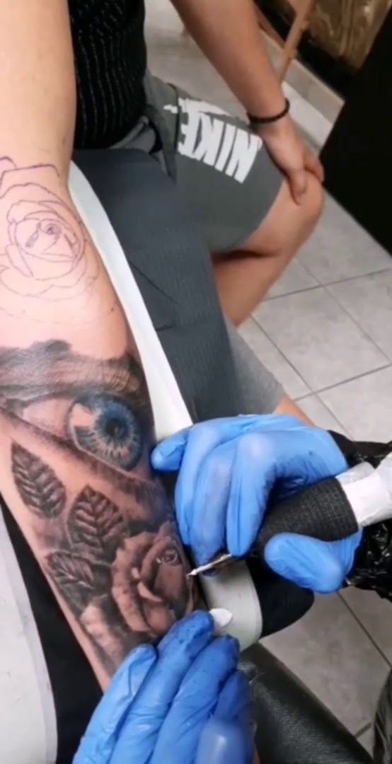 a cover-up tattoo artist is working on a man's arm, bitburg-prüm, germany