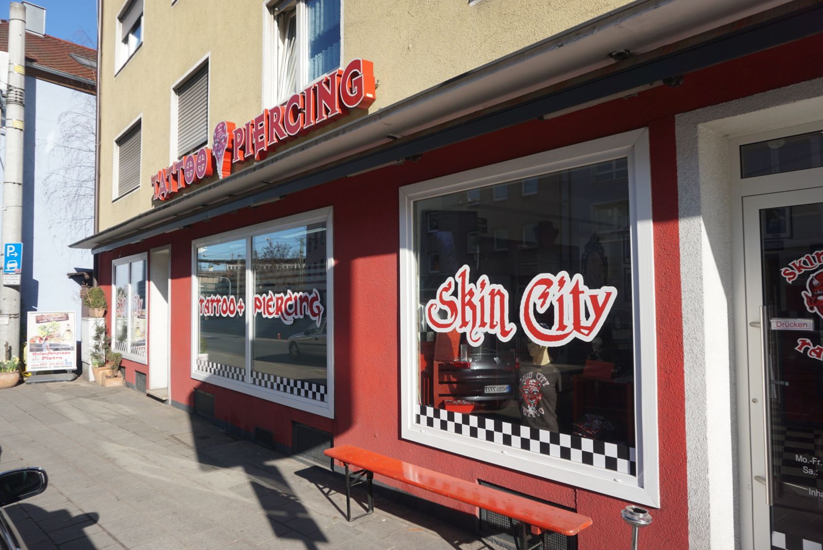 a red and white building with a sign that says chili city