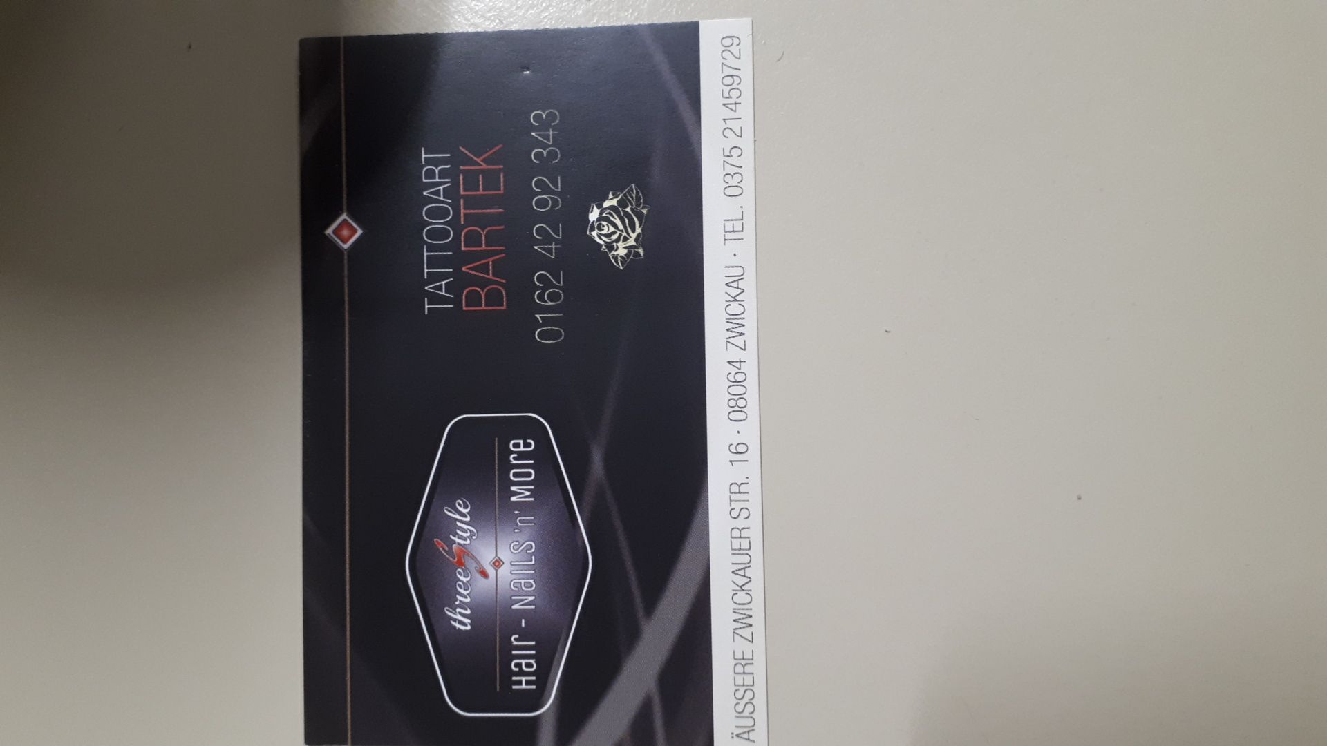 a box of a black and white perfume