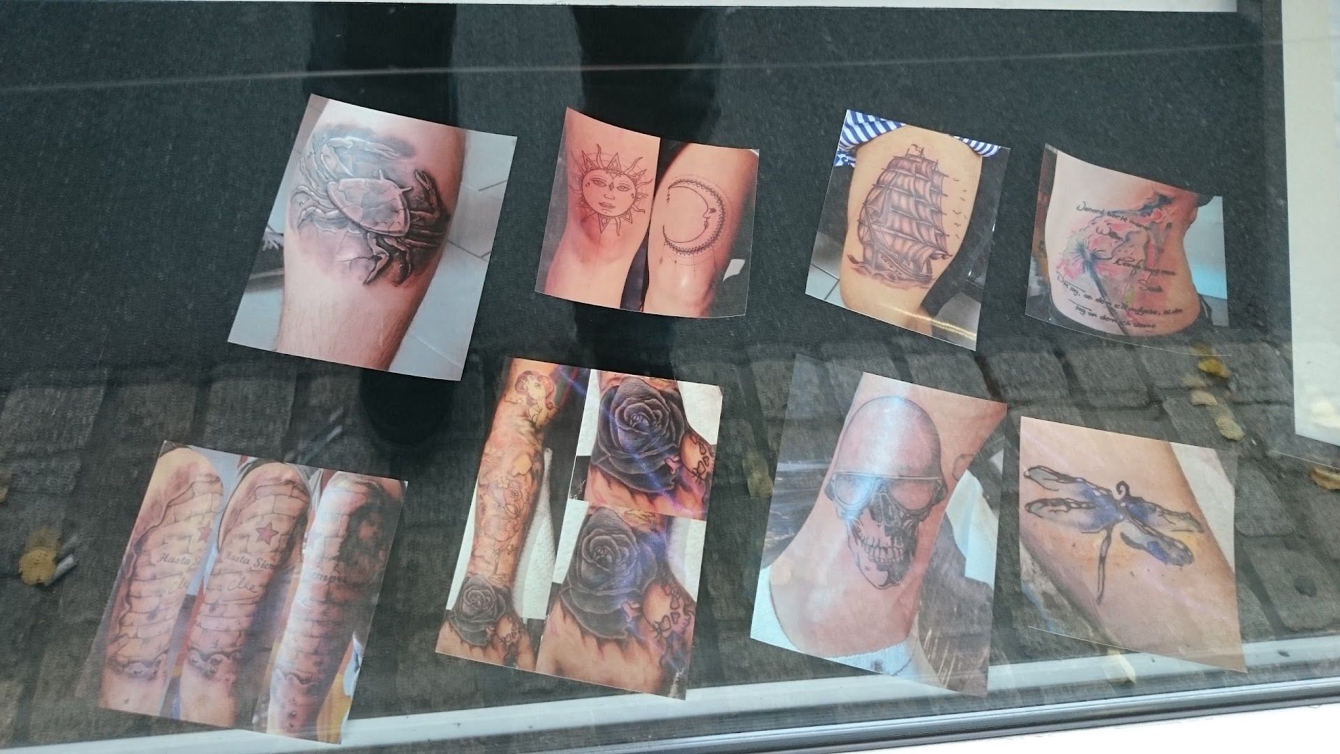 a display of narben tattoos and other items in a window, böblingen, germany