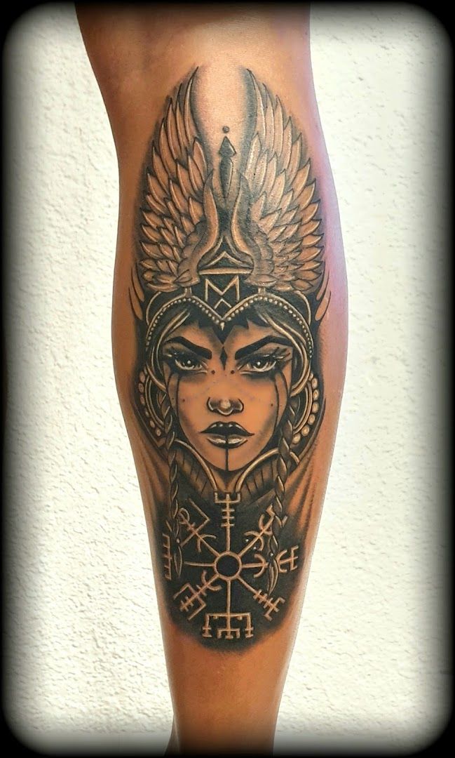 a geschiche der maori tattoos of a woman with wings and a cross, alzey-worms, germany