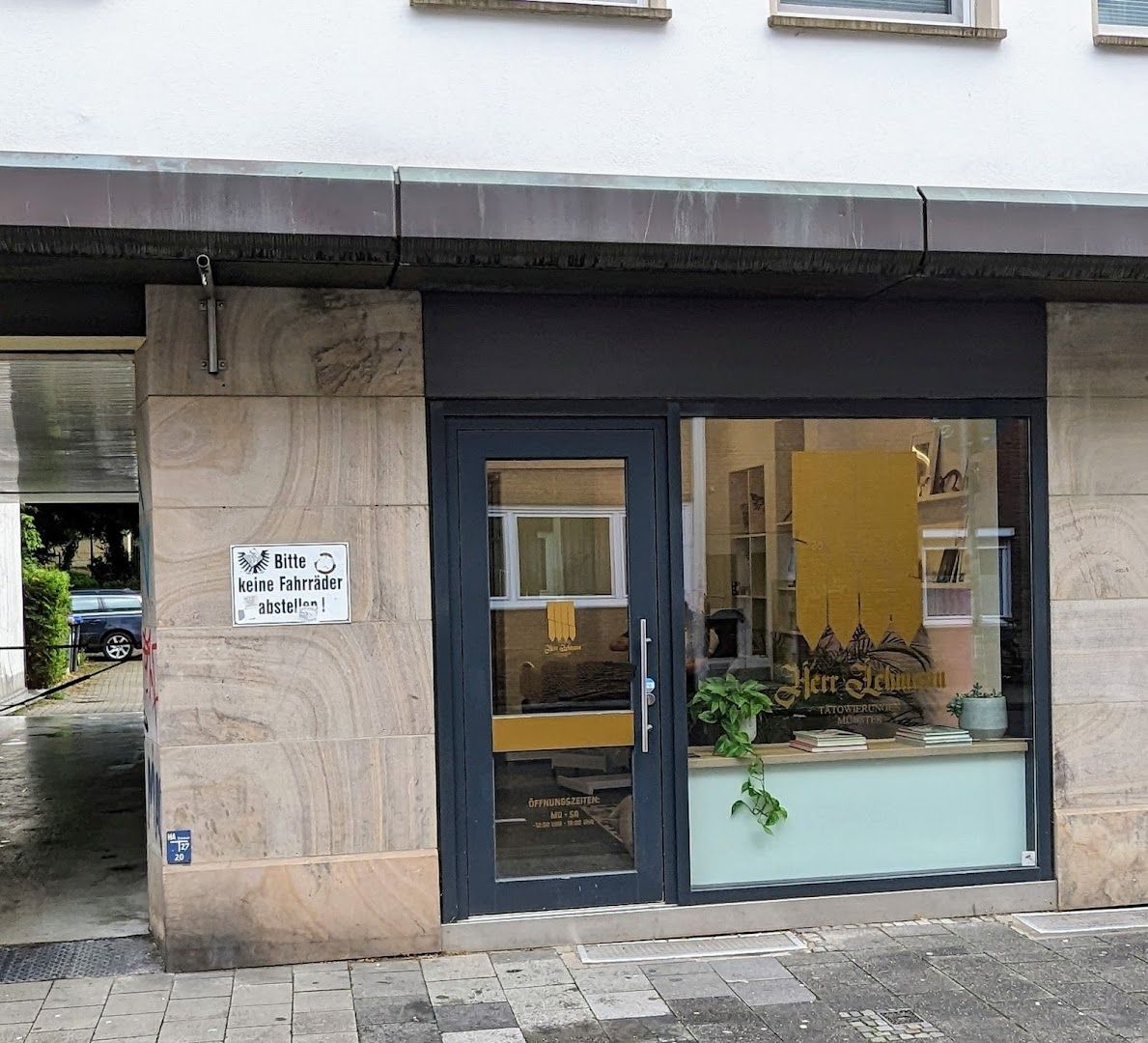 a building with a sign that says the entrance to the building