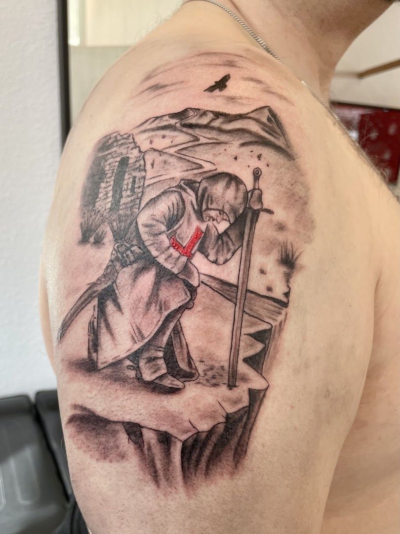 a man with a cross narben tattoo on his shoulder, böblingen, germany
