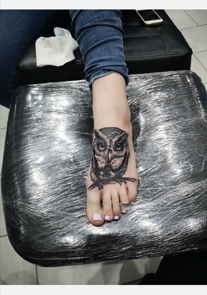 a woman's foot with a blackwork tattoo on it, neumarkt, germany