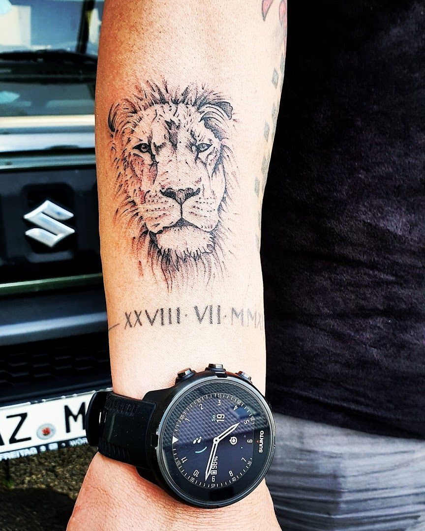 a man with a wrist narben tattoo of a lion, alzey-worms, germany