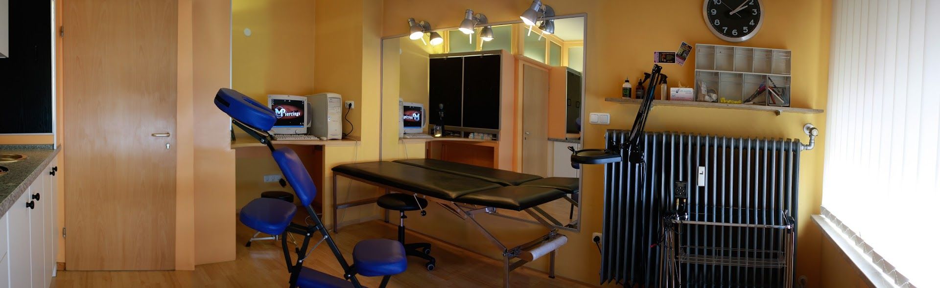 a kitchen with a sink, stove, and a microwave