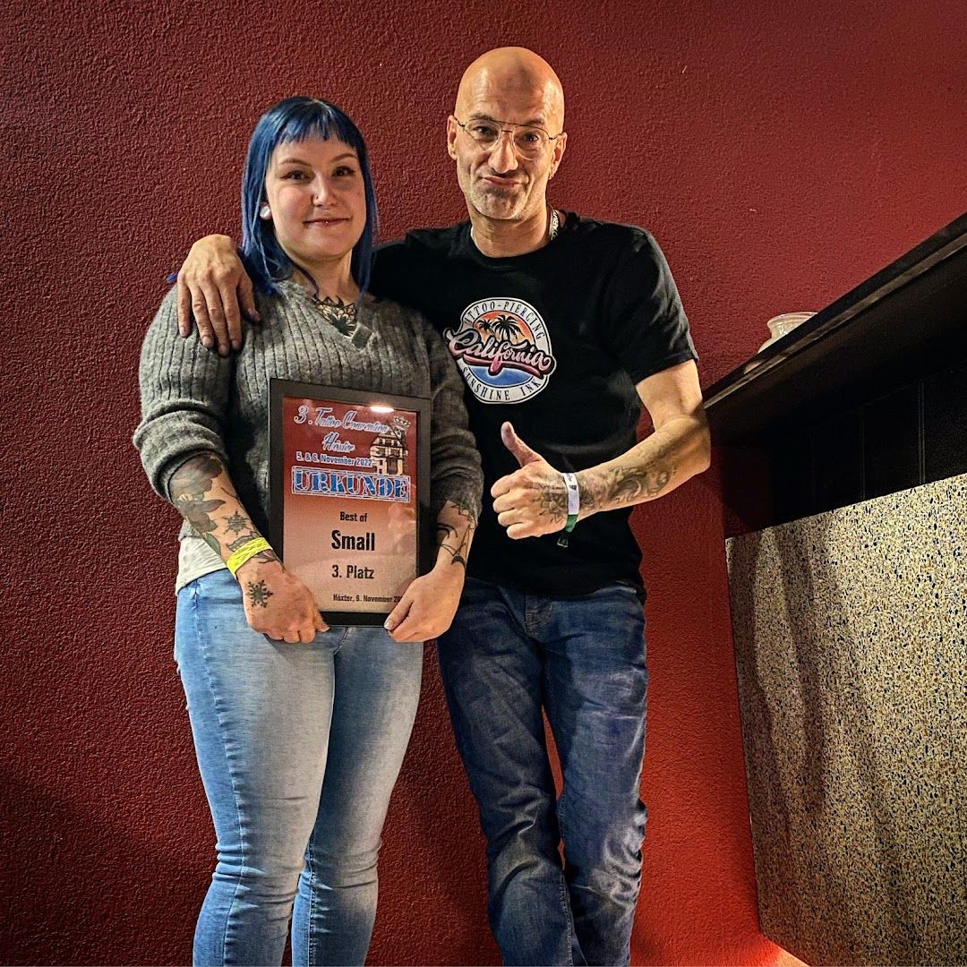 a man and woman standing next to a podium