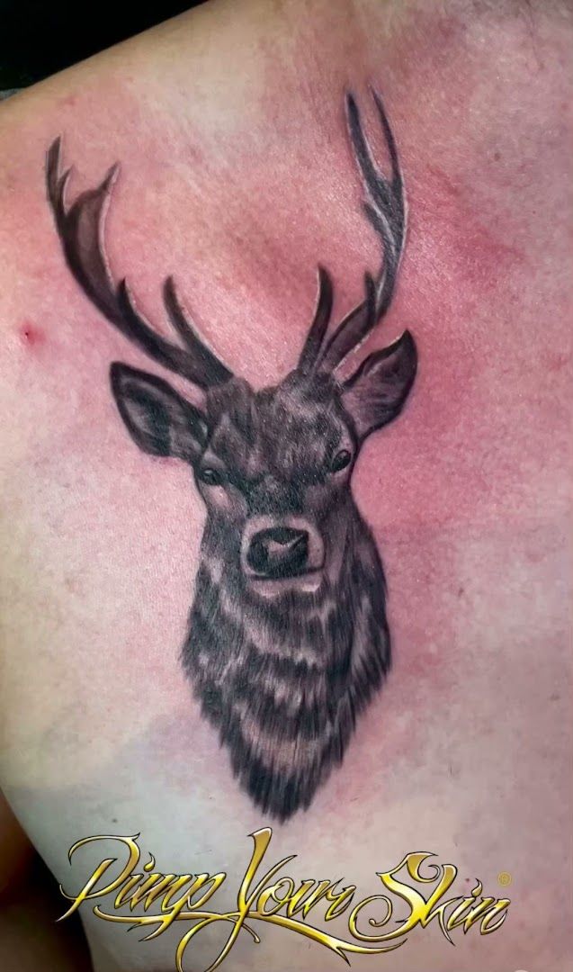 a deer cover-up tattoo on the back of a woman, augsburg, germany