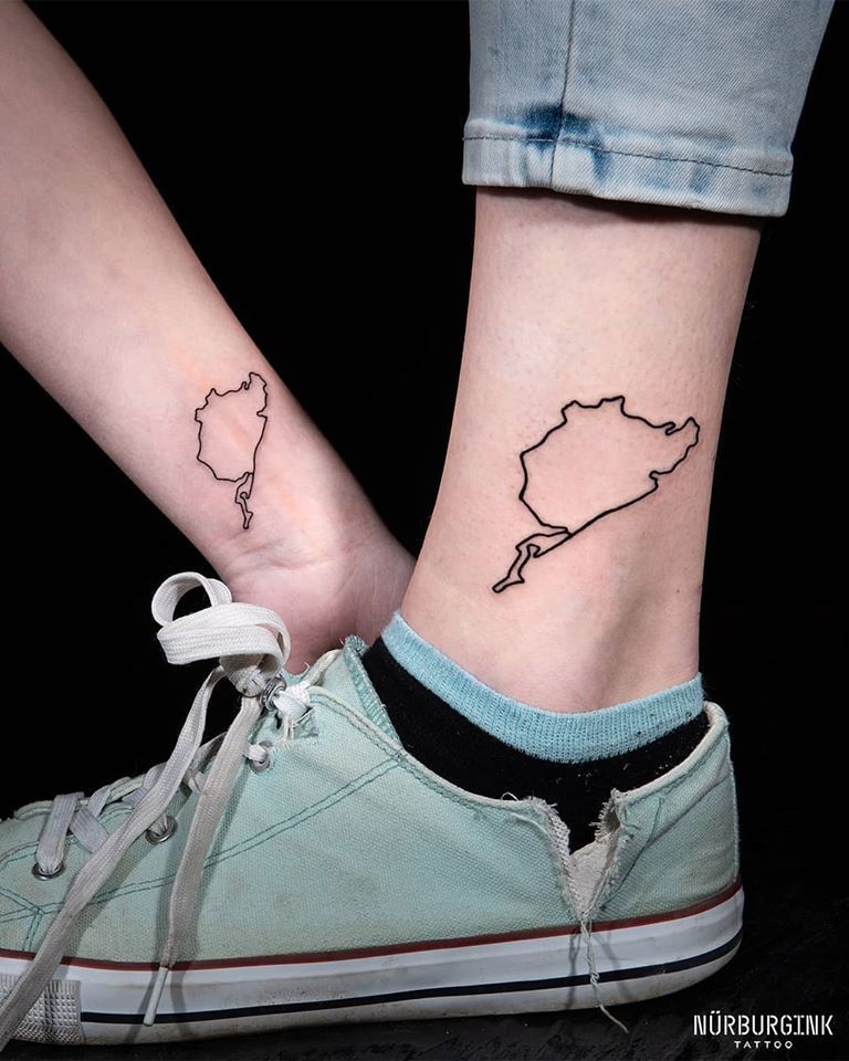 a woman's foot with a small cover-up tattoo of a map, ahrweiler, germany