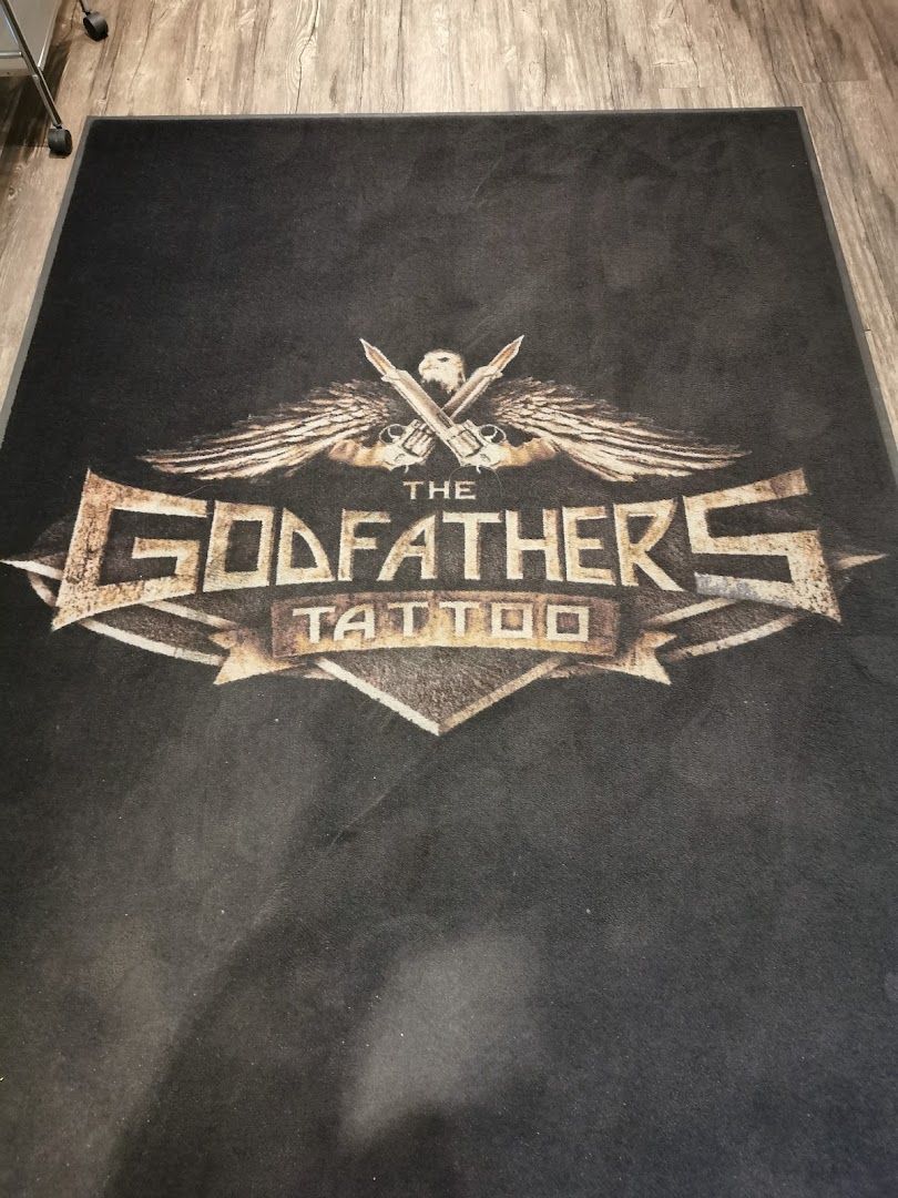 the godfather logo on a black carpet