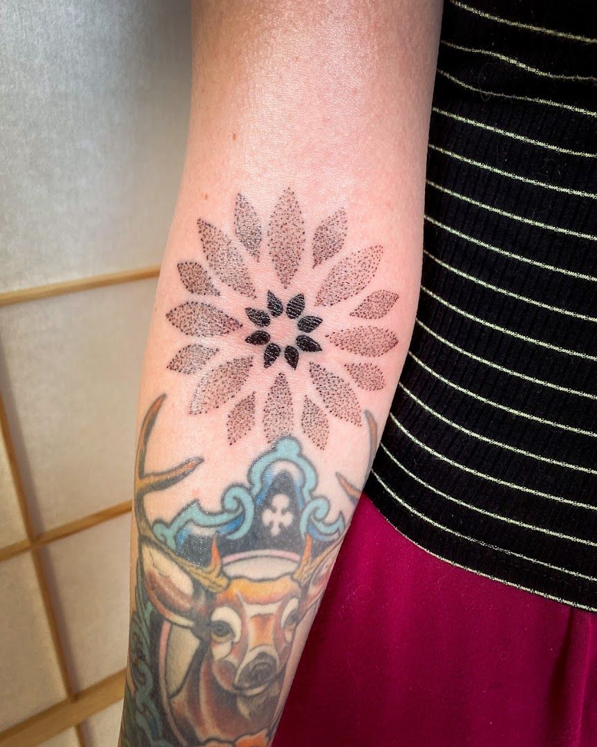 a narben tattoo with a flower on the arm, altenkirchen, germany