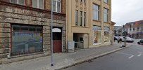 a street with buildings and cars parked on the side