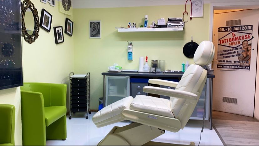 a dentist chair in a room with a desk and chair