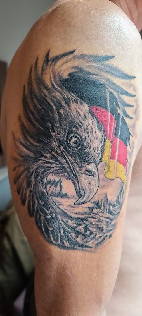 a bald eagle with a german flag on his arm