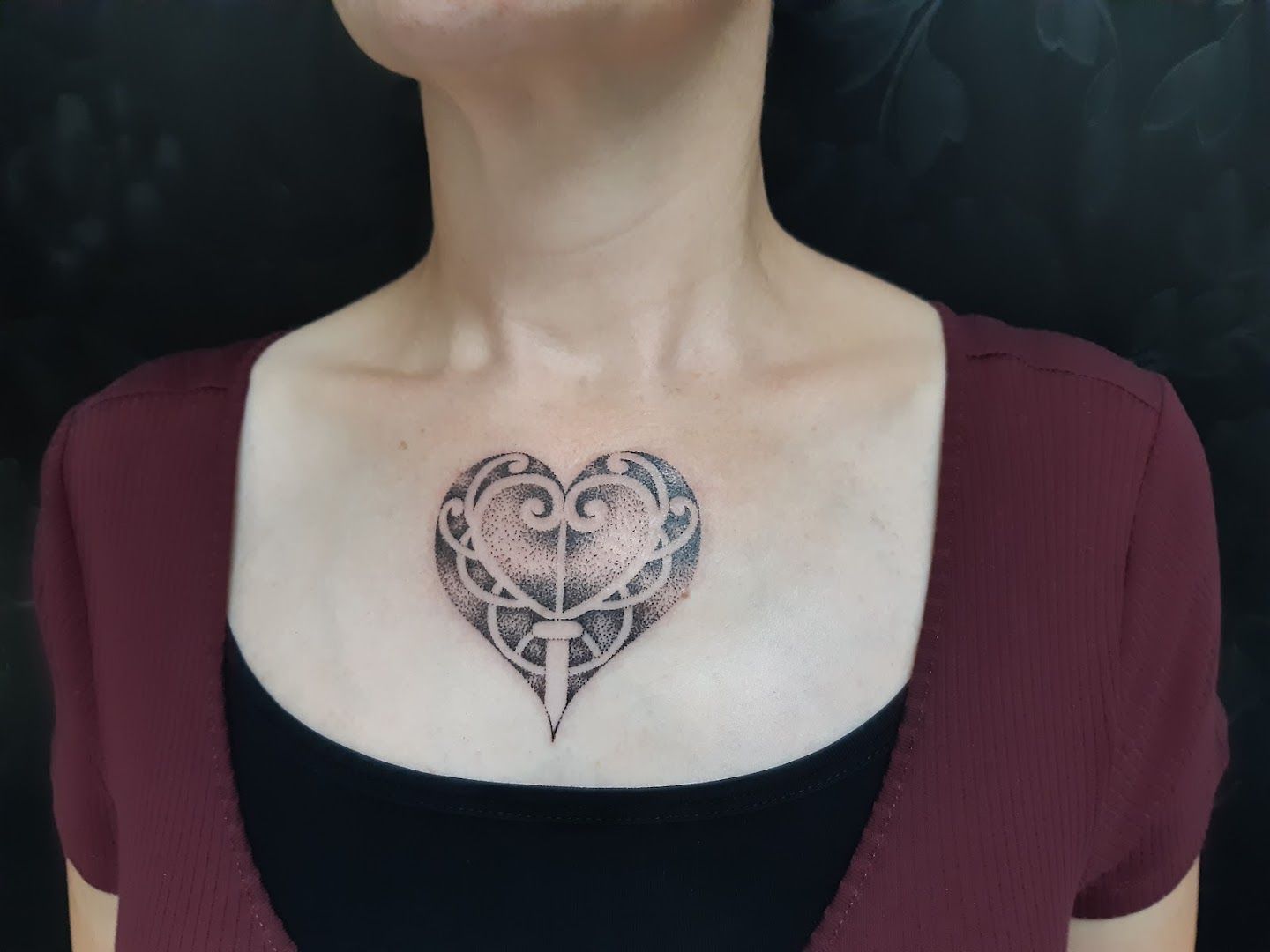 a woman with a heart cover-up tattoo on her chest, aichach-friedberg, germany