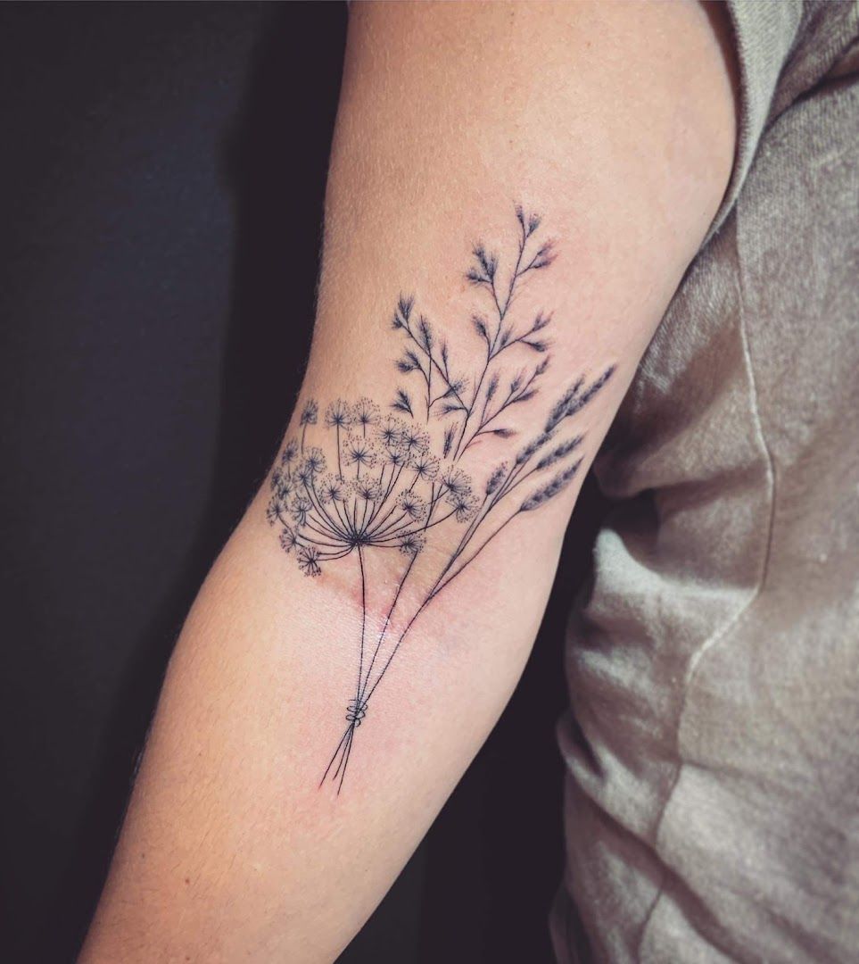 a narben tattoo with a flower on the arm, saale-orla-kreis, germany