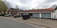 a house with a driveway and a car parked in front