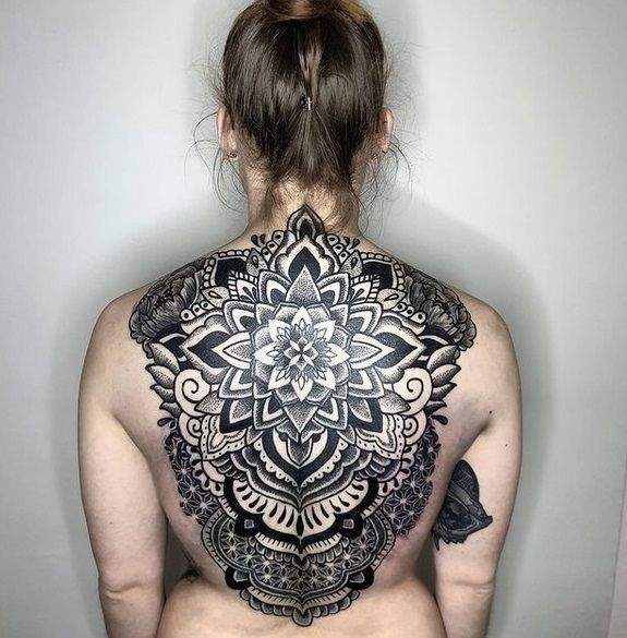 a woman with a narben tattoo on her back, bodenseekreis, germany