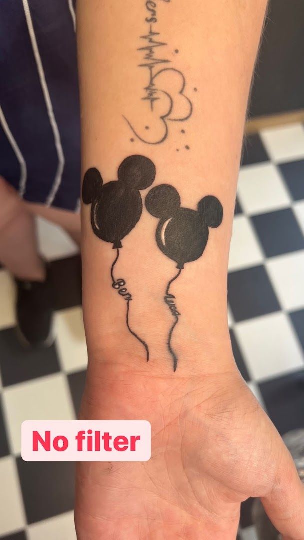 a narben tattoo with a mickey mouse and mickey mouse ears on it, rosenheim, germany