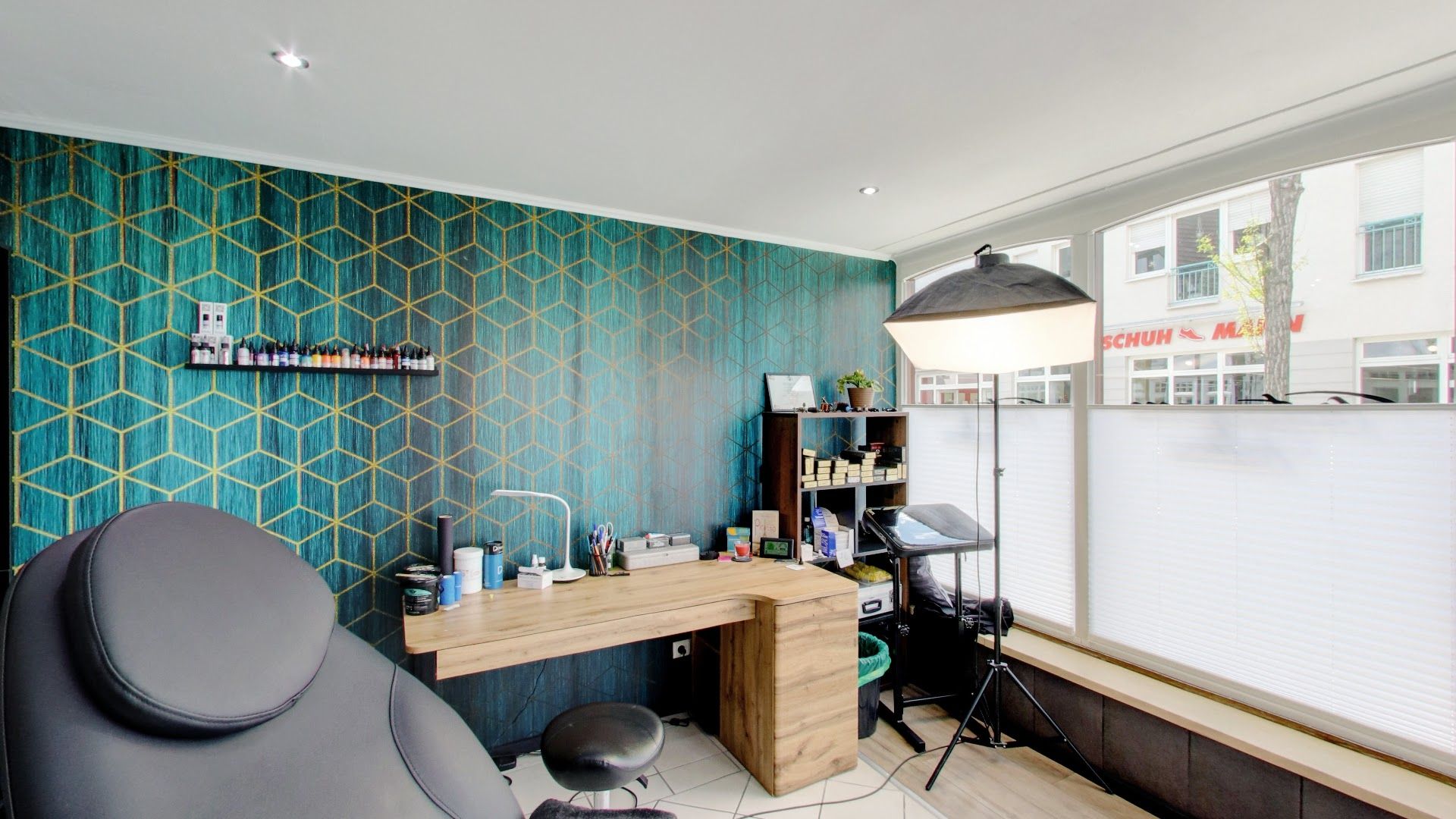 a room with a desk and chair in it