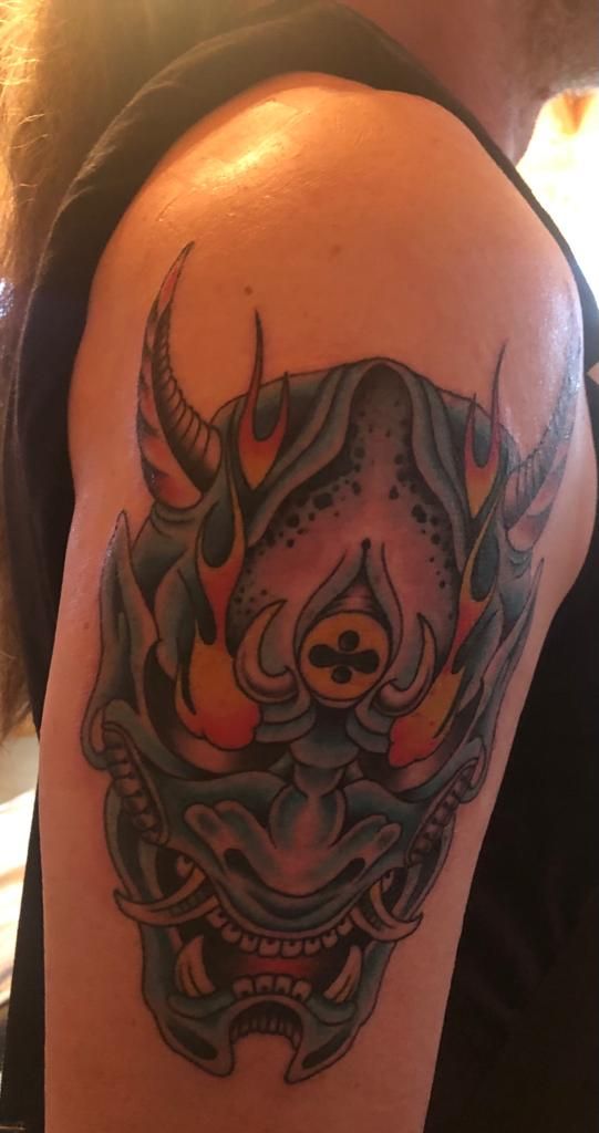 a japanische tattoos in leipzig of a bull with a red and blue flame, bad dürkheim, germany