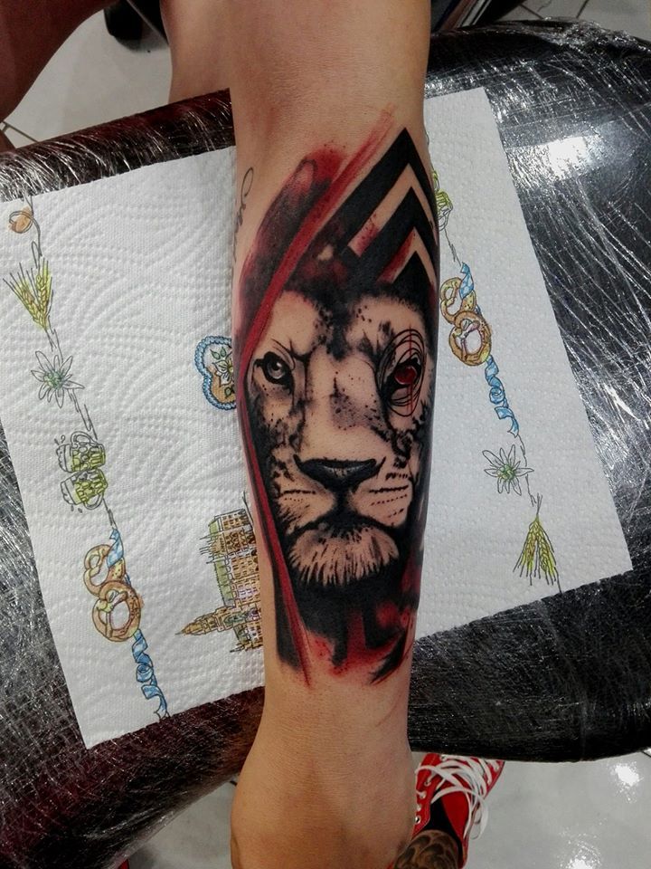 a blackwork tattoo of a lion on the forearm, neumarkt, germany