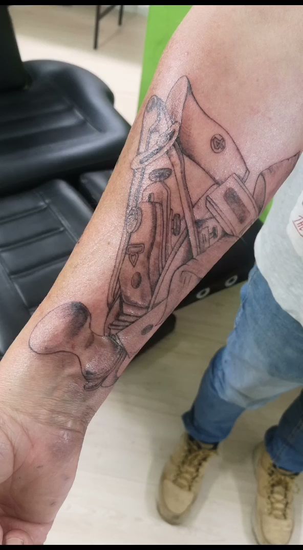 a narben tattoo of a man's hand with a gun, ansbach, germany