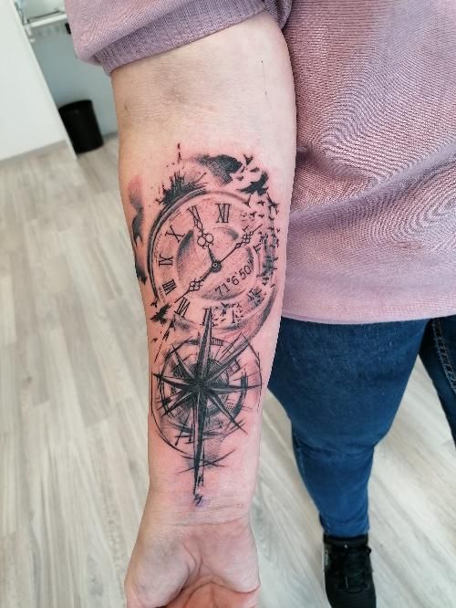 a cover-up tattoo with a compass on the arm, paderborn, germany