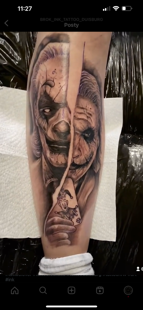 a cover-up tattoo of a joker and a woman, duisburg, germany