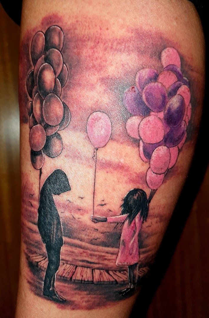 a narben tattoo of a couple holding balloons, hamelin-pyrmont, germany