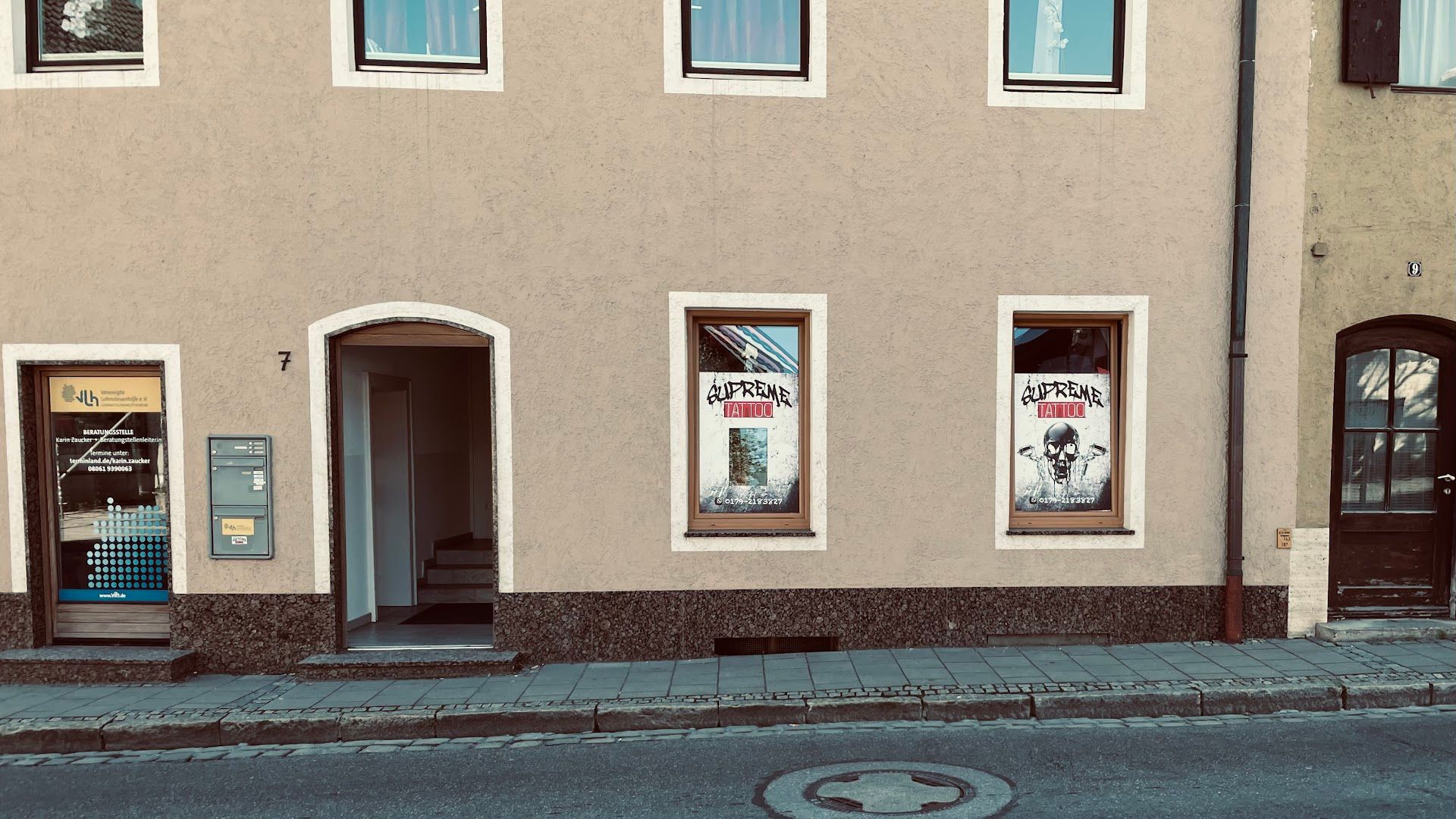 a building with windows and a sign on the side