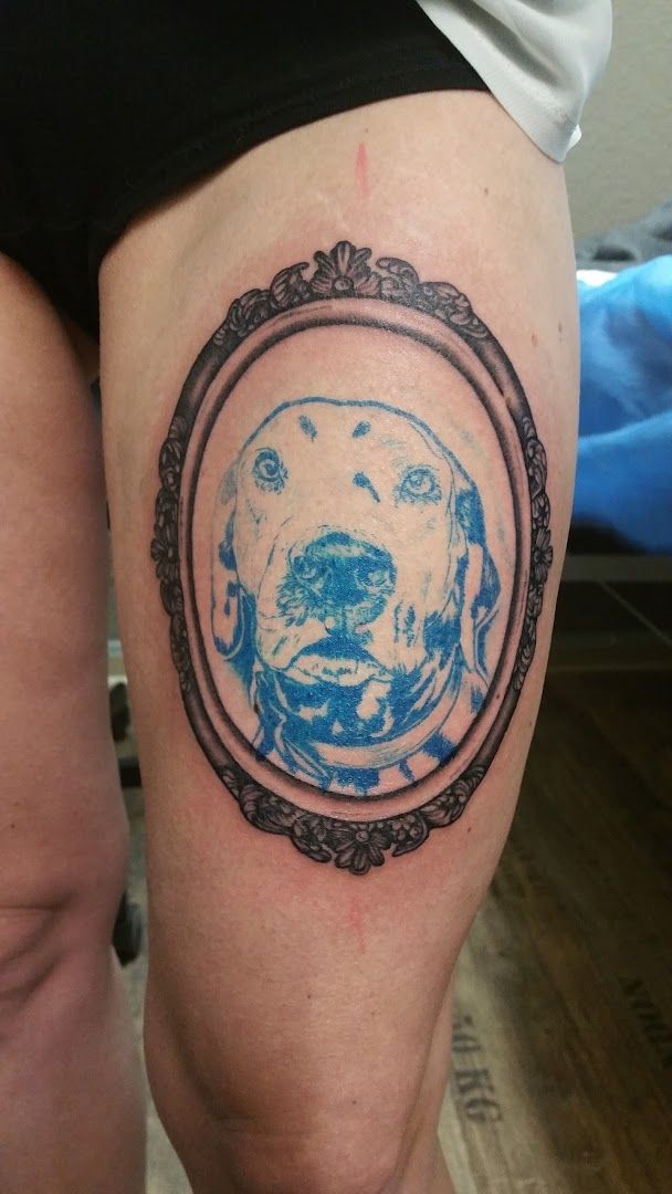 a cover-up tattoo of a dog in a frame, kreisfreie stadt gera, germany