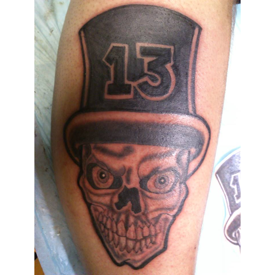 a skull with a top hat and a skull face