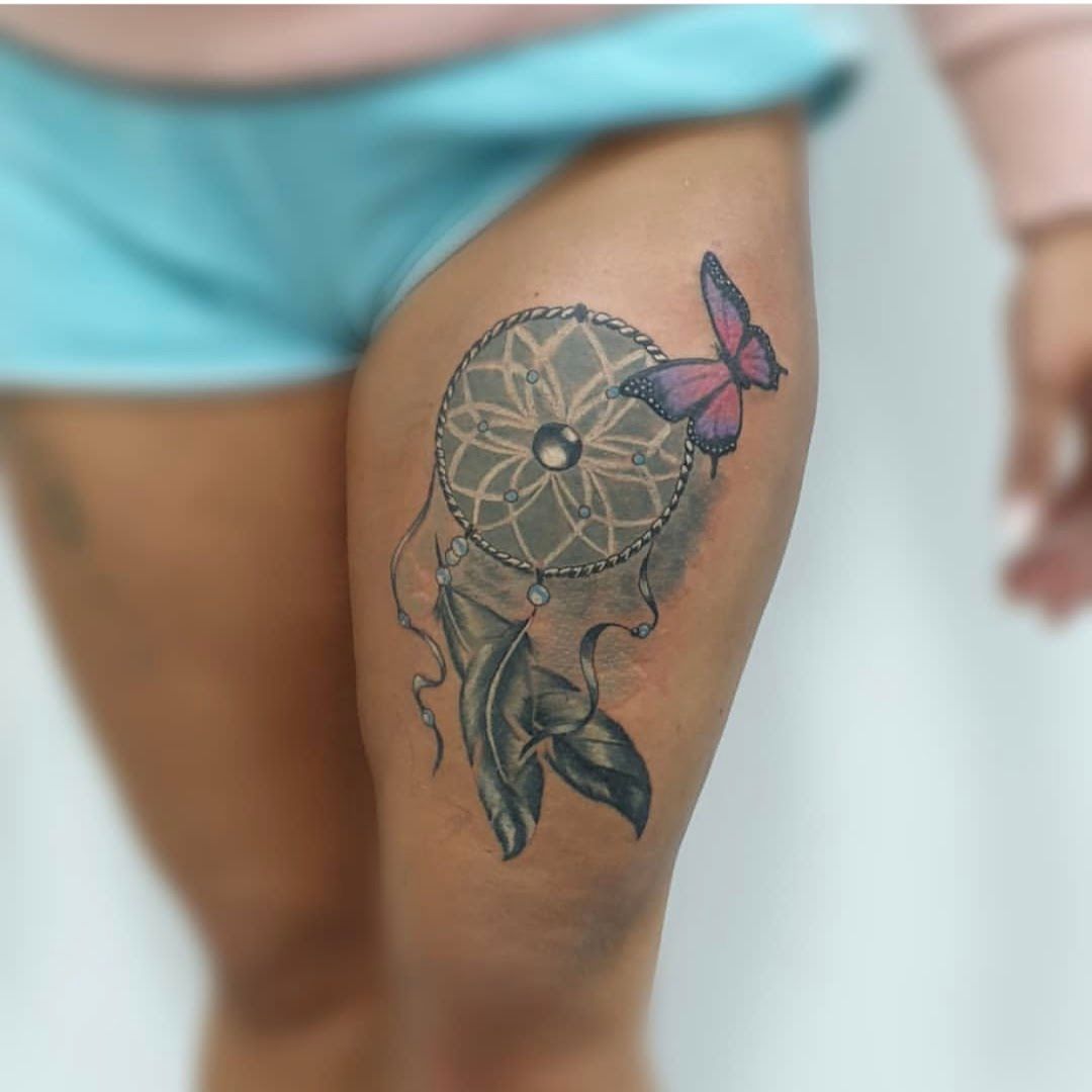 a woman's thigh with a japanische tattoos in leipzig of a dream catcher, göppingen, germany