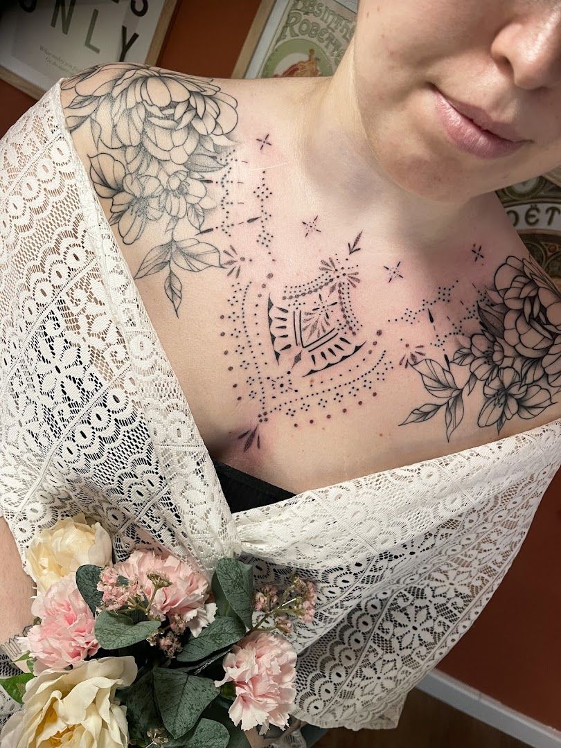 a woman with a blackwork tattoo on her chest, rhein-neckar-kreis, germany