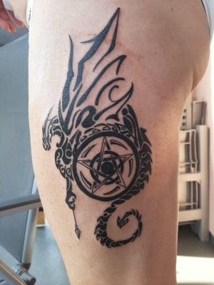 a narben tattoo of a dragon on the leg, rhein-erft district, germany