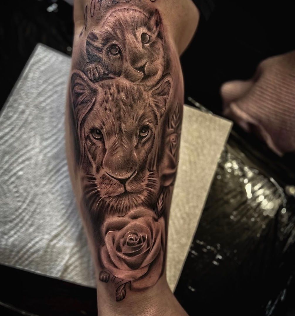 a lion and rose cover-up tattoo on the forearm, duisburg, germany