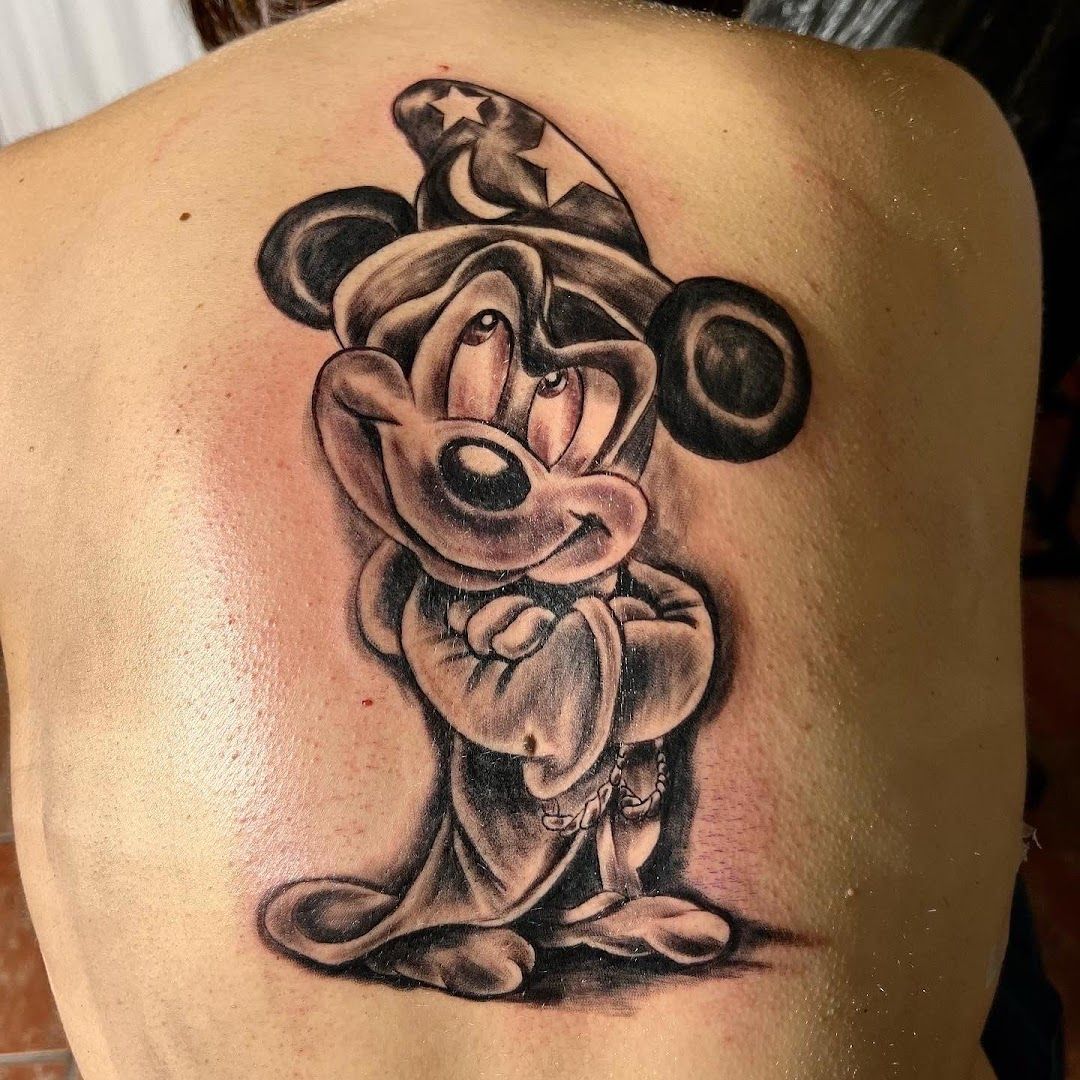 mickey mouse cover-up tattoo on shoulder, bernkastel-wittlich, germany