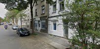 a street with cars parked on the side of it